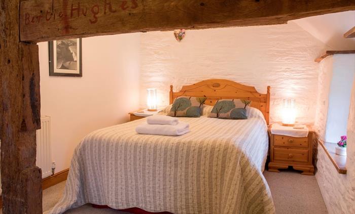 Sleep soundly in this comfy bed in the Granary self catering cottage, looking out over the meadows at Nannerth Fawr Farm.